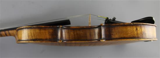 A violin bearing label for Maggini and date 1616, 14.5in., length overall 23.5in.